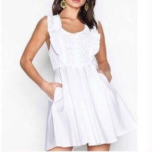 Free People “half moon”white mini dress with floral lace inset & ruffles.Size XS